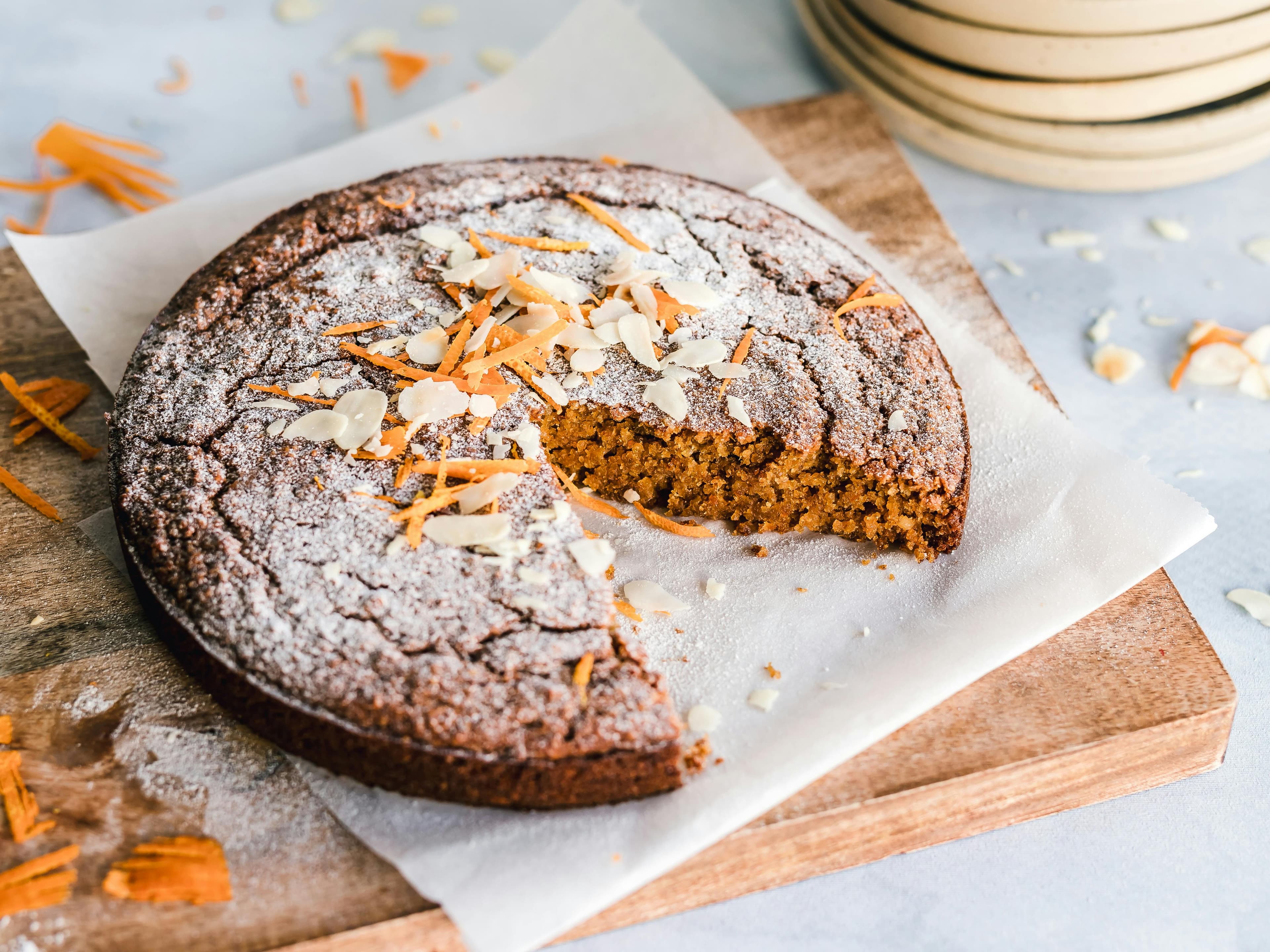 Freshly baked cake topped with sliced almonds