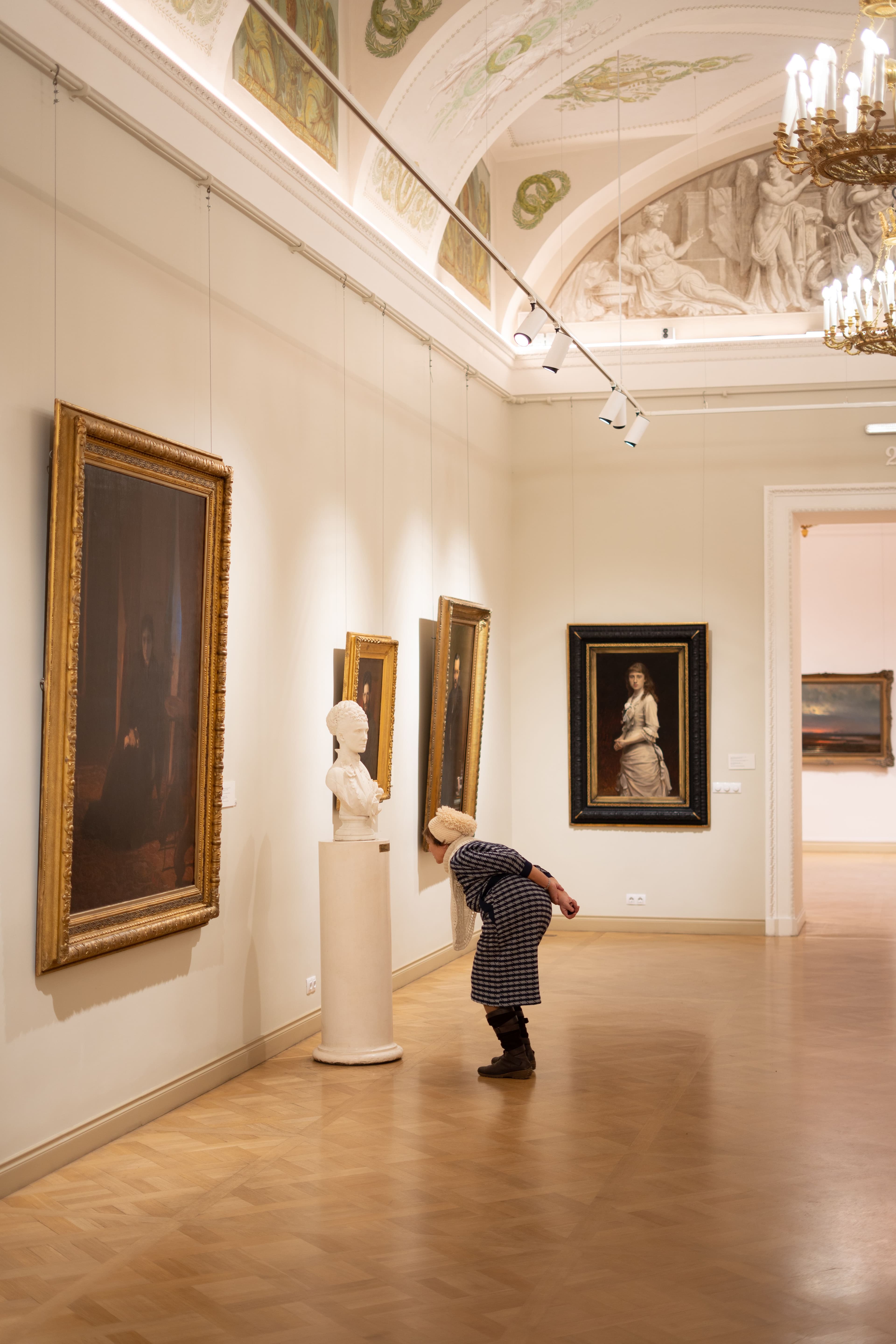 Person enjoying art in a museum